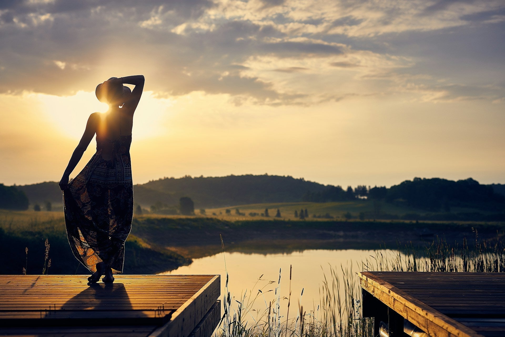 woman standing beside the lake